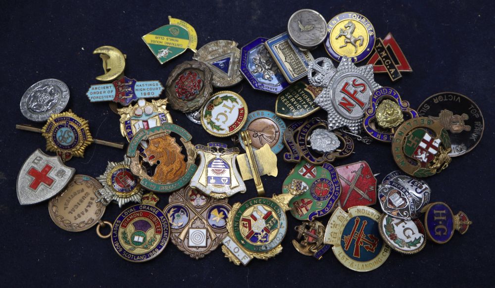 A collection of vintage cap badges